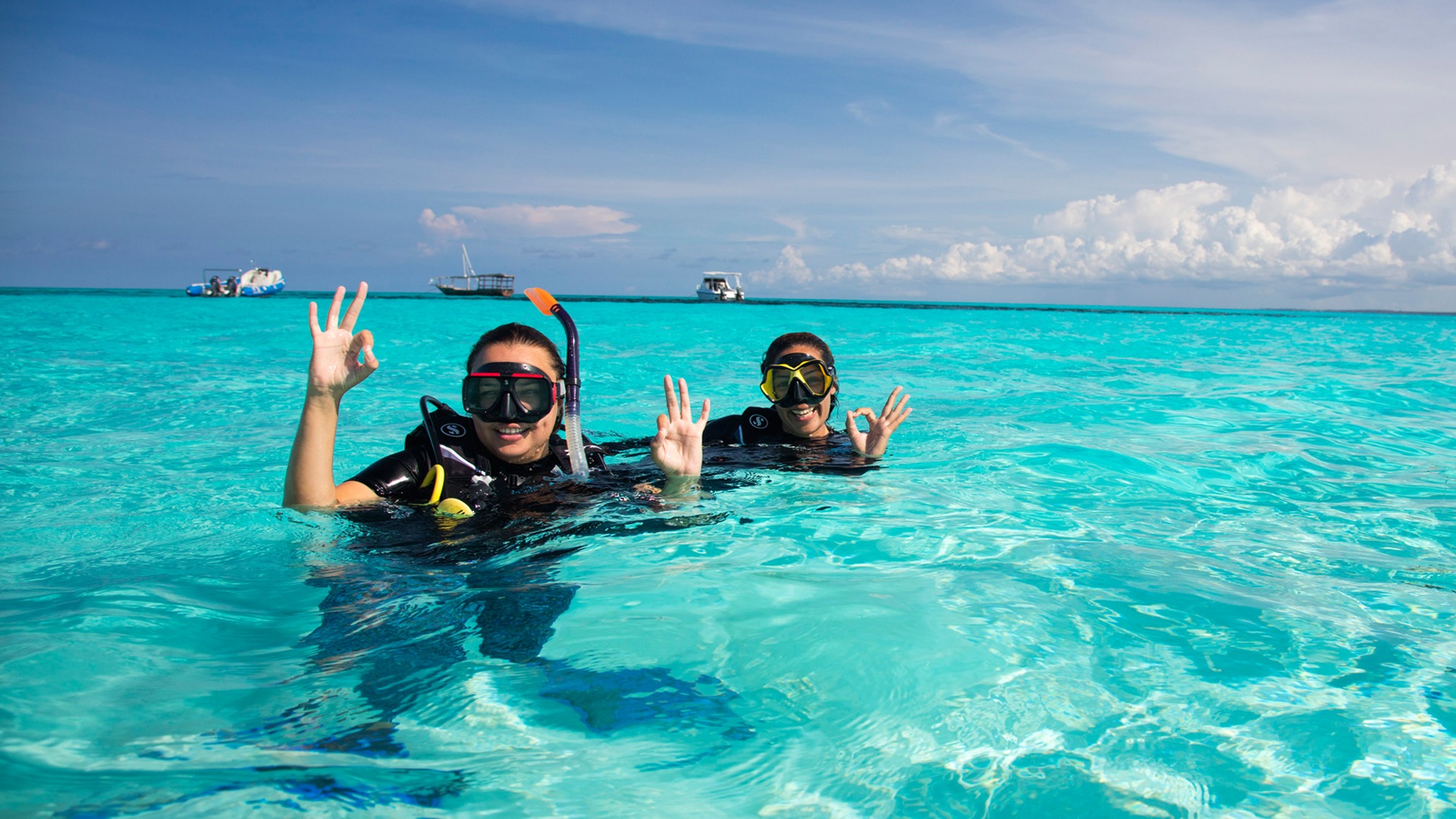 two girls doing swimming in beach