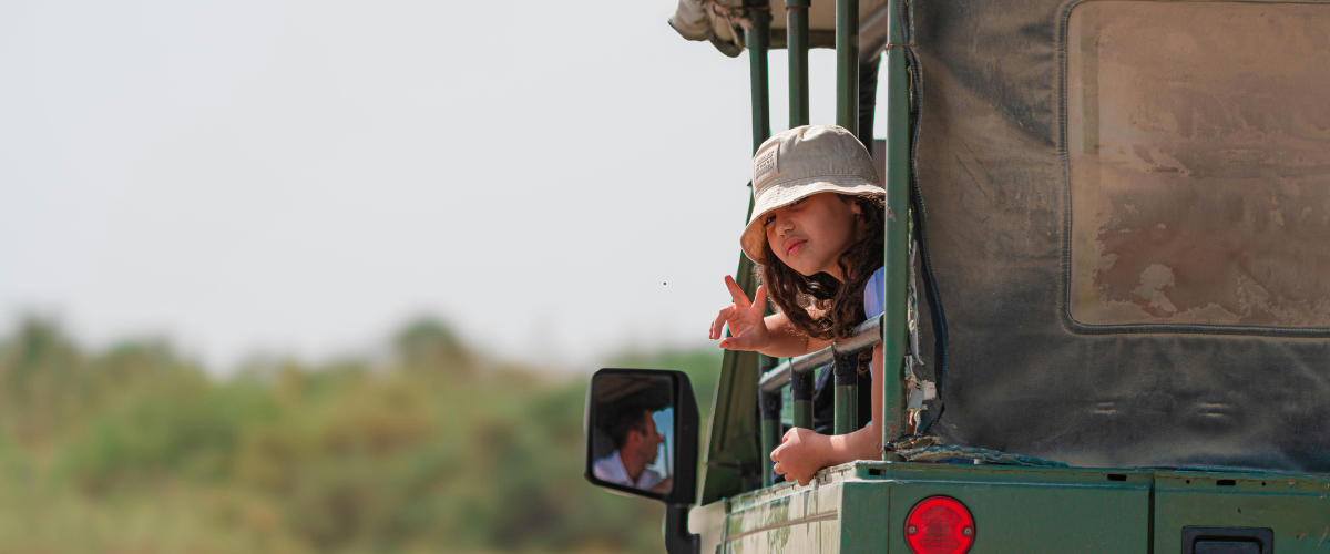 Small group of travelers enjoying a wildlife safari in Tanzania